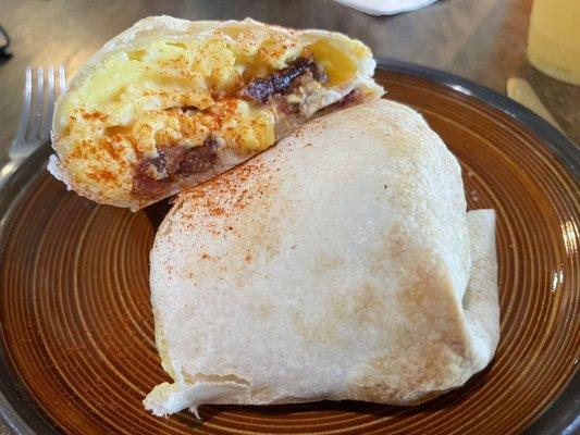 Egg bacon burrito, tasty and filling.