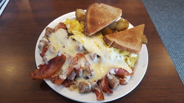 Meat Lover omelette w/ home fries and toast.