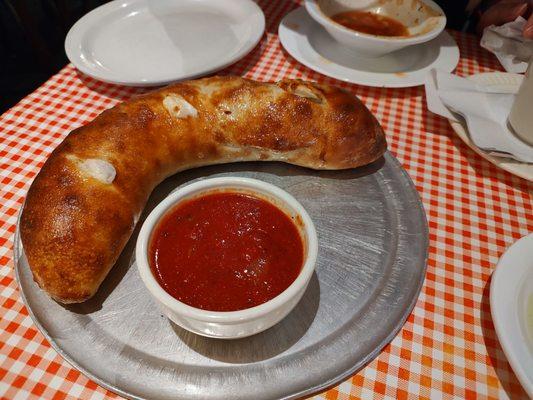 Meat Stromboli with marinara sauce.