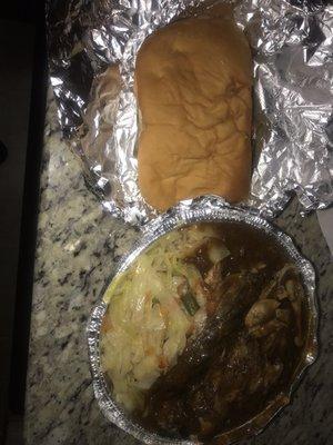 Jerk Chicken with rice and peas, cabbage, and coco bread!  Not the best photo, she was hungry after her work shift!