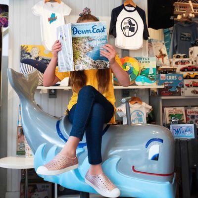 Kiddos enjoy our vintage whale ride while family members shop.