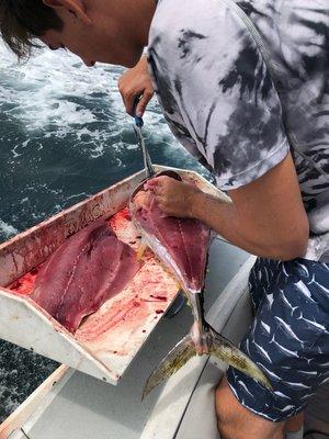 Daniel cleaning our catch!