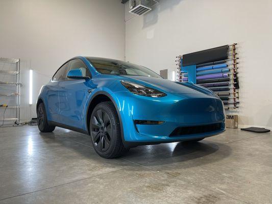 Tesla Model Y wrapped in 3M Gloss Atomic Teal