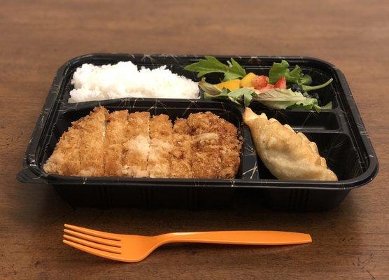 Pork Katsu Bento (double layer of Kutsu), rice, salad and deep fried gyoza (potsticker)--A really delicious lunch to go!