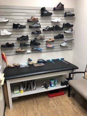 Patient room with examples of some of the diabetic and extra depth shoe styles available.