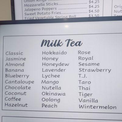 Close up of milk tea flavors on menu board