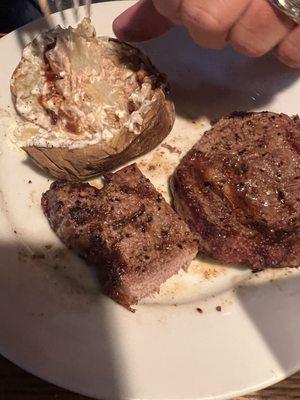 Ribeye med well cooked, baked potato with butter and sour cream and steak sauce.... The ribeye seasoned so well that no sauce was needed