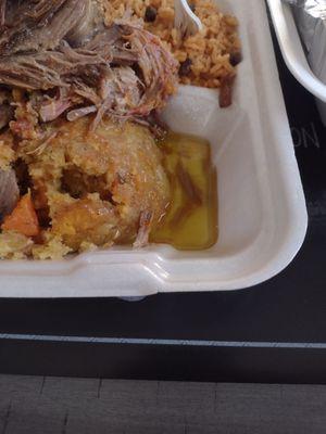 Mufongo pernil in pool of grease/oil.