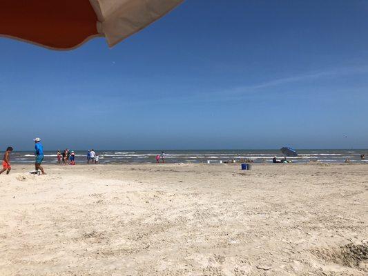 Chillin' under the umbrella while the waves crash in from the Gulf of Mexico