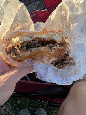 Half eaten bbq sandwich