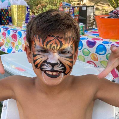 Tiger face paint, painted by Cynnamon in El Cerrito, CA.