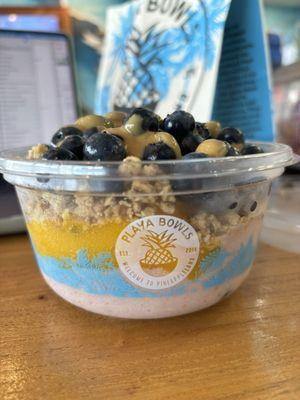 Half stupid Cupid bowl and half mango base, topped with blueberries and granola