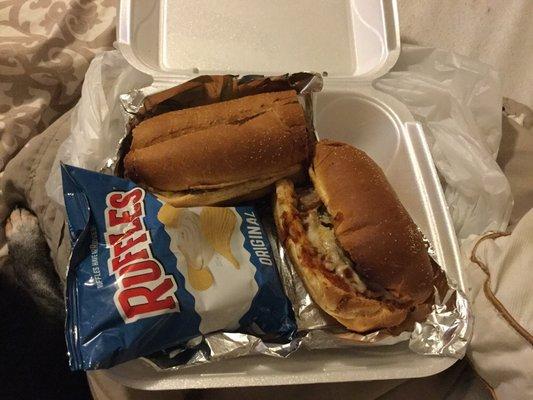 Sausage parm sub. (Notice my dog's paw casually next to the food lol)