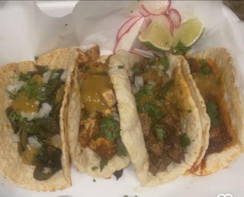 Rajas, Pollo norteño, adobada (res), and chorizo tacos on homemade corn tortillas