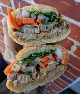 The perfect Pork Belly Banh Mi; juicy, spicy, tangy, perfect crunch from the pickled veg, kick from the jalapenos. King of this sandwich.