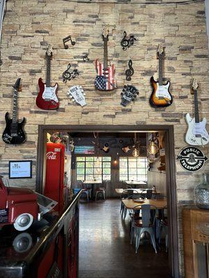 Near the cashier station.  Look at those guitars!