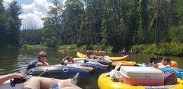 Campers tubing down river