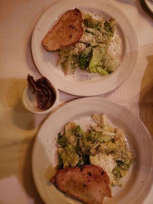 Caesar salad split on two plates