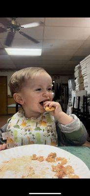 Baby eating pizza