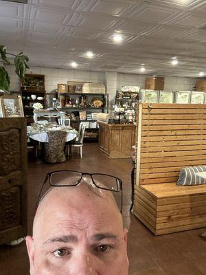 My bald head and the entrance behind me, showing the marketplace.