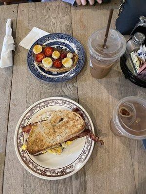 Breakfast sandwich and strawberry banana Nutella toast.