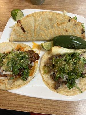 Chicharrón Prensado on the left and Carne Asada on the right. Quesadilla on top.