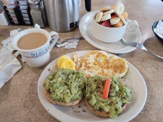 Avocado toast and fruit...sorry I ate the other tomato before I took the pic.