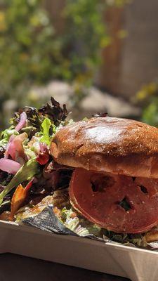 The Pollo Verde Chicken club sandwich, side salad with cilantro ranch.