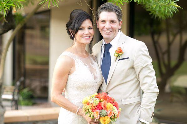 Lovey bride and handsome groom with fall flowers.