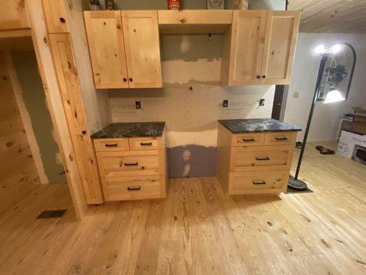 Cabinets where the stove will go.