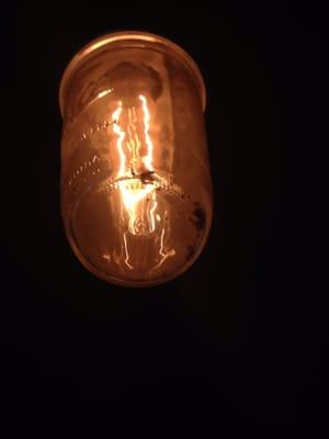 One of the many light fixtures above the bar full of old dead bugs....