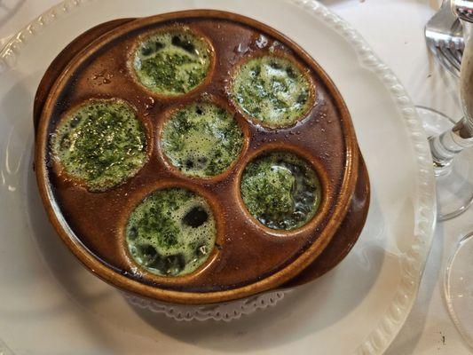 Escargot served bubbling hot yum