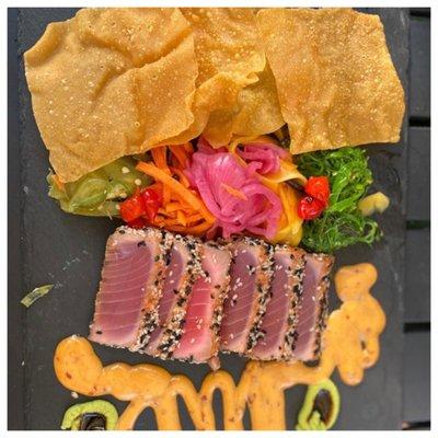 Sesame Crushed Ahi Tuna- citrus-soy glaze, seaweed salad, sriracha aioli, pickled veggies, wasabi paste and wonton chips.