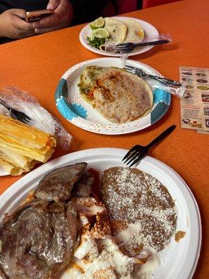 The tacos on top , gorditas middle , chilaquiles rancheros bottom