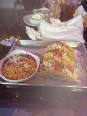 3 beef tacos, rice, beans