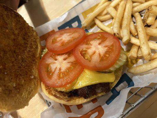 Kids cheeseburger condiments you have to add on as an extra like tomatoes, onions pickles