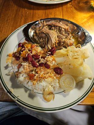 Pork, rice, red beans and yucca, I like mixing everything together.