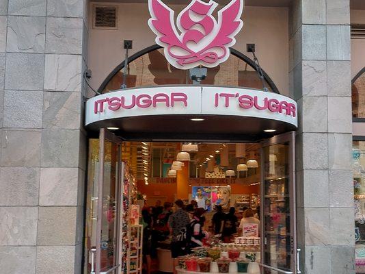 The glass doors welcoming everyone in to the great store of Its Sugar the magic and the mystery of candy and chocolate.