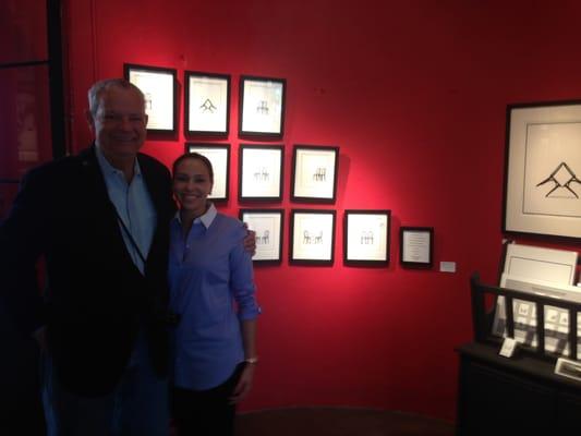 Happy customer and Louis in front of the" Shared Vision" collection she purchased.