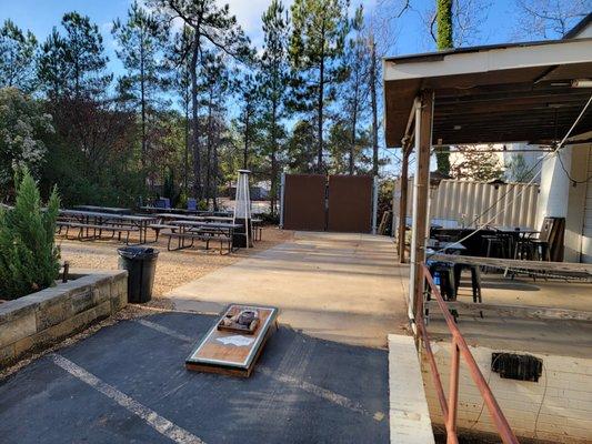 Enjoy some cornhole while hanging out in our outside area