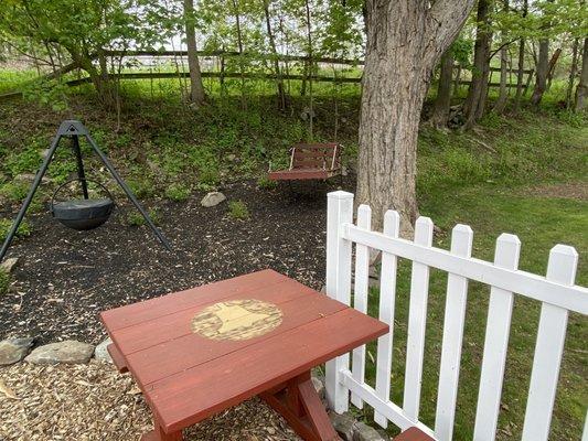 A swing and great picnic table.