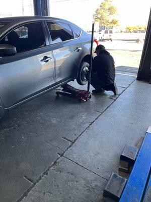 Guy working on the tire