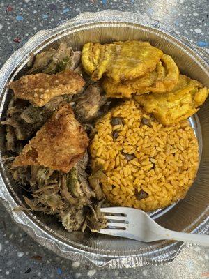 Roasted pernil with Spanish rice and tostones