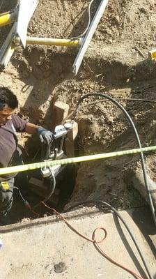 Installing trenchless sewer install after sewer inspection.