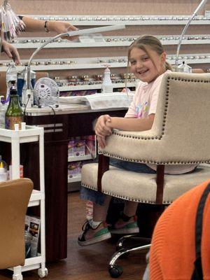 My daughter getting a manicure