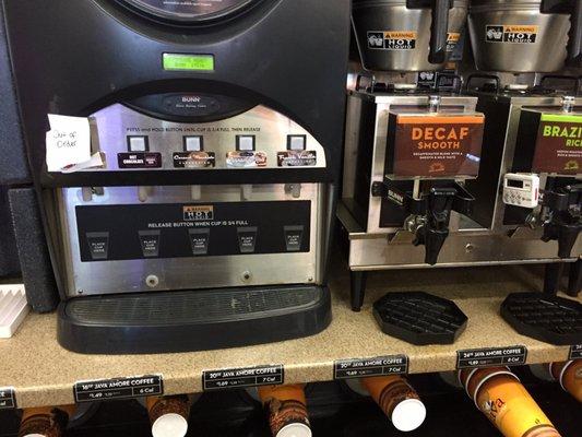 "Latte" machine, one section out of order, and 5 different types of coffee.