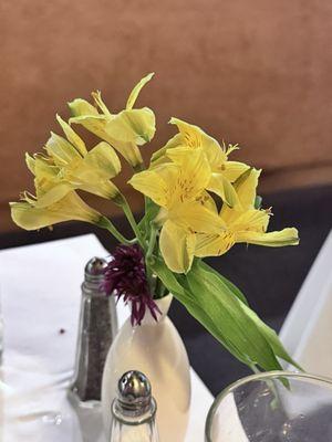 nice touch with real flowers on the table