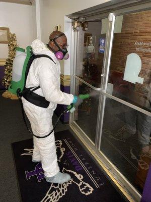 Technician performing a Professional Disinfectant Service, using a ELECTROSTATIC (Fogger)BACKPACK SPRAYER