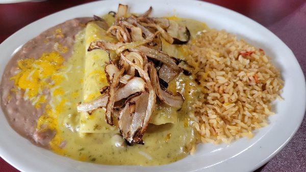 Fajita enchiladas topped with spicy queso & sautéed onions.