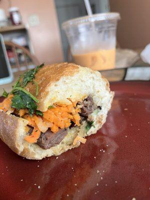 Grilled pork banh mi and half filled thai tea